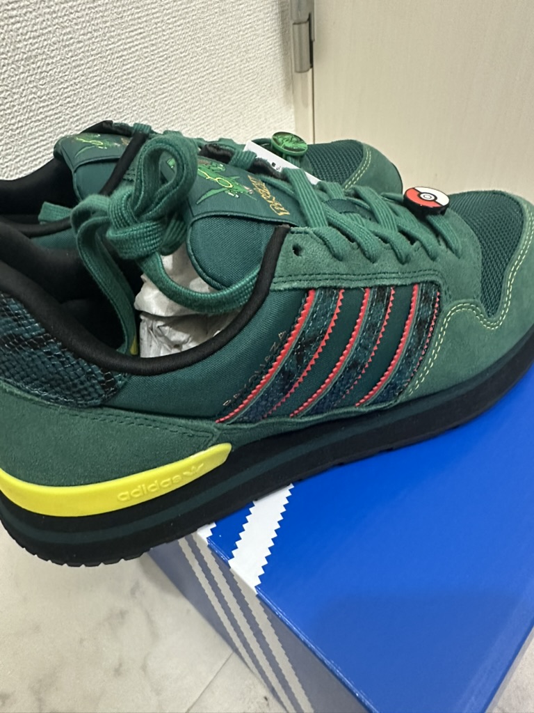 Angled view of Rayquaza adidas sneakers